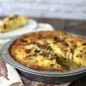 Keto Quiche Lorraine next to a slice on white plate