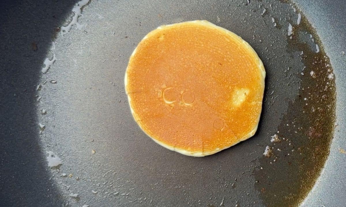 pancake in a frying pan.