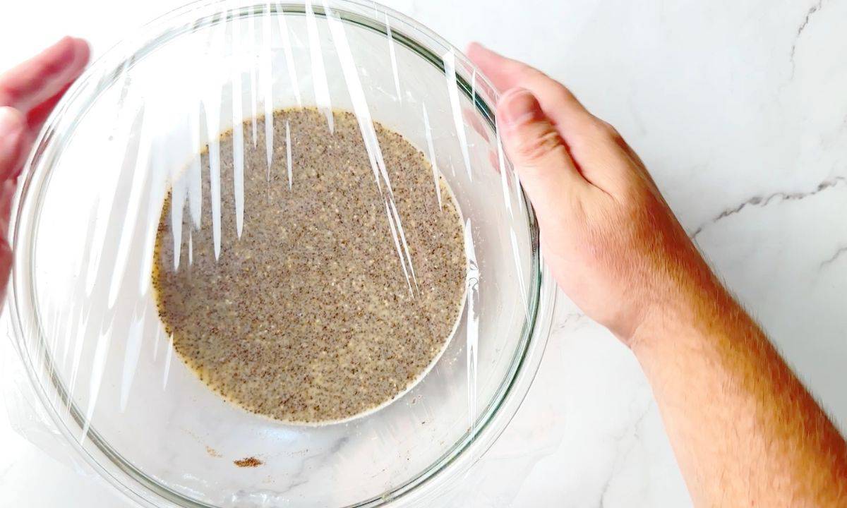 wrapping the mixed chia pudding in a bowl with plastic wrap.