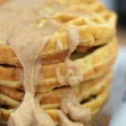 stack of sugar free waffles with a cinnamon cream cheese icing.