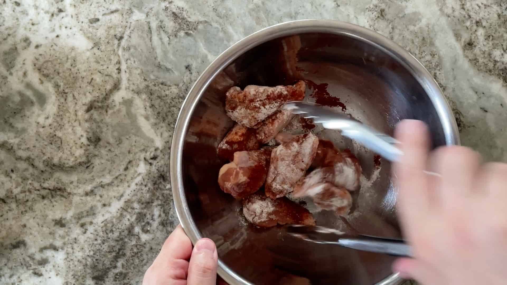 mixing wings in bowl