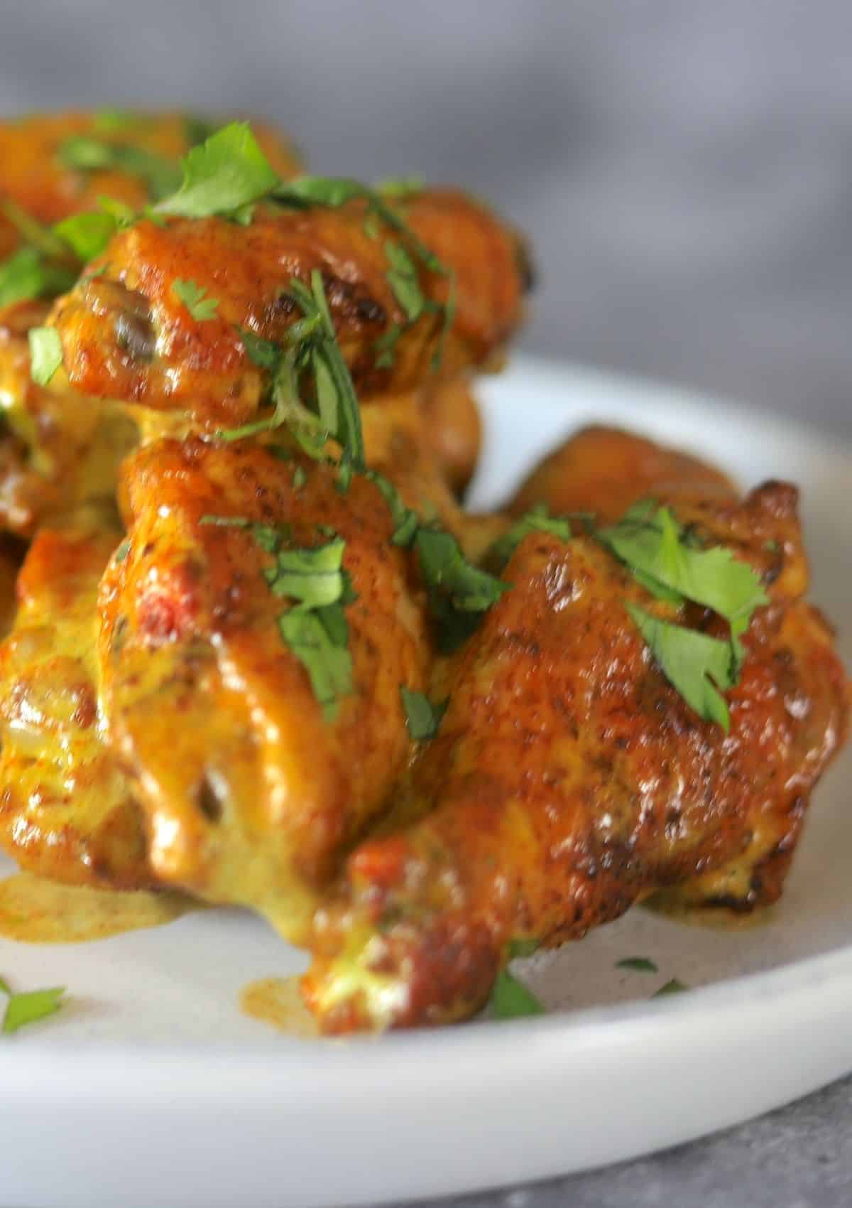 Cilantro Lime Chicken wings on a white plate