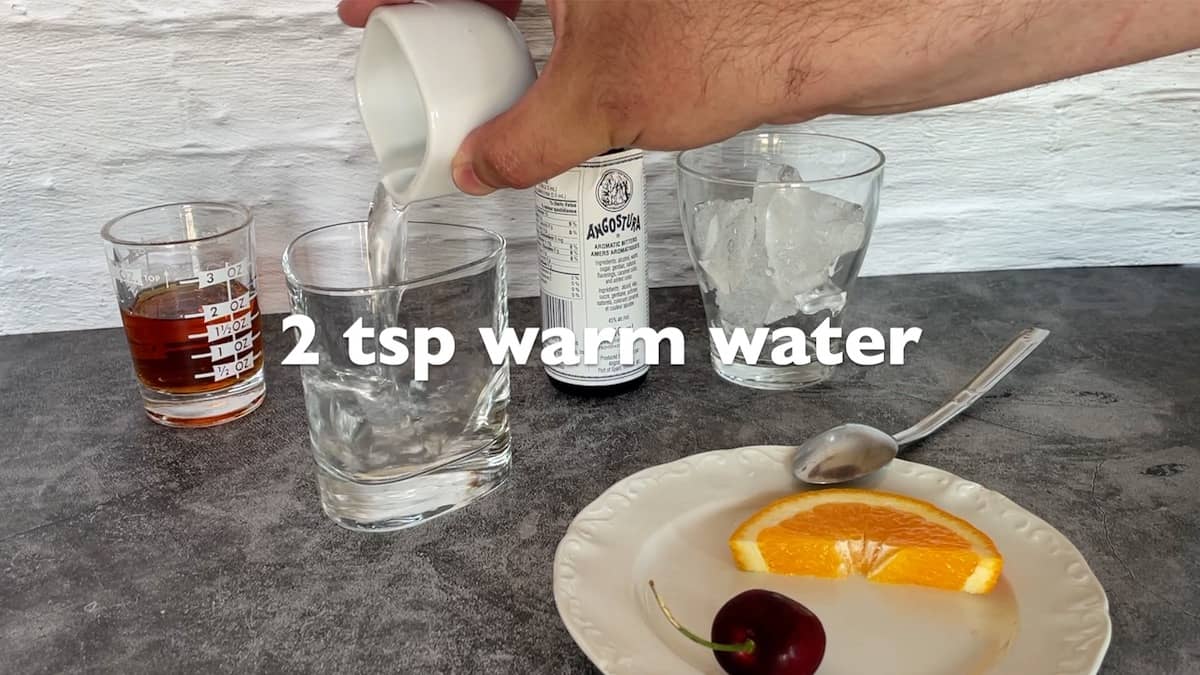 adding warm water to a tumbler