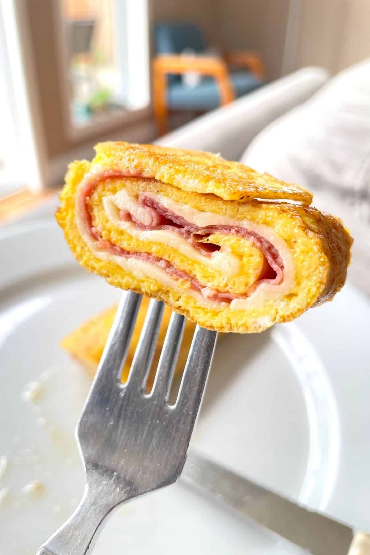 sliced egg roll up pinwheel on a fork