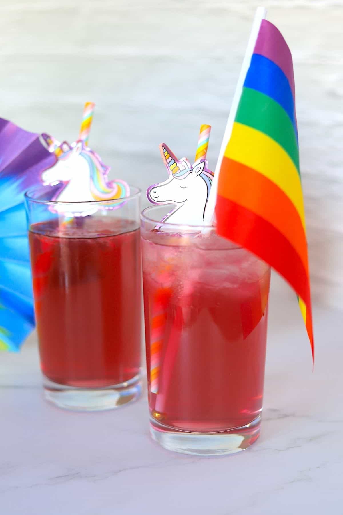low carb unicorn cocktail with pride flag and unicorn straw
