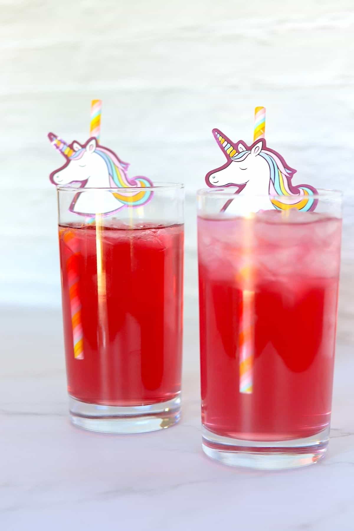 two glasses of low carb unicorn cocktail with unicorn straws