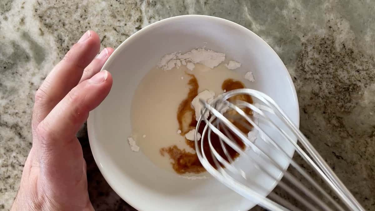 mixing the glaze in a medium bowl