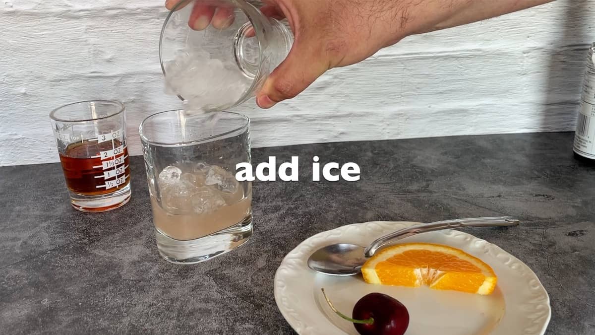 adding ice to the glass