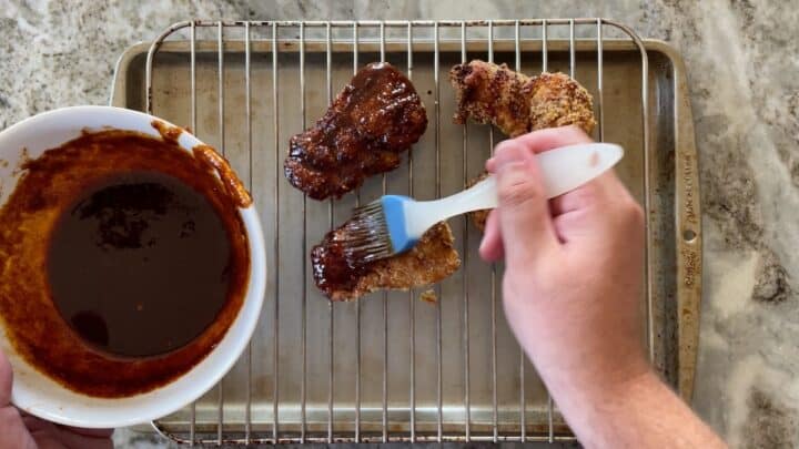 brushing chicken with spice blend paste