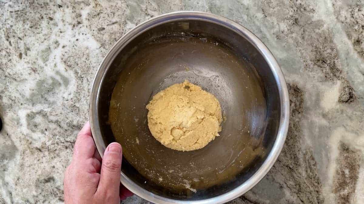 dough mixed together into a ball in the large bowl