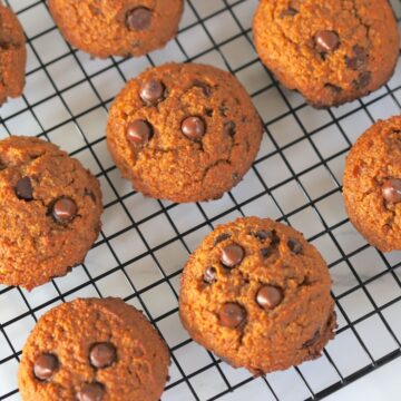 baked pumpkin cookies on a colling rack