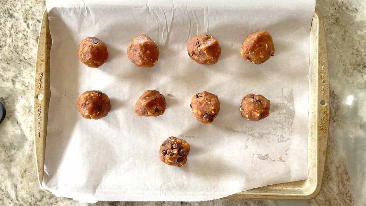 balls of 1 inch cookies on a baking sheet