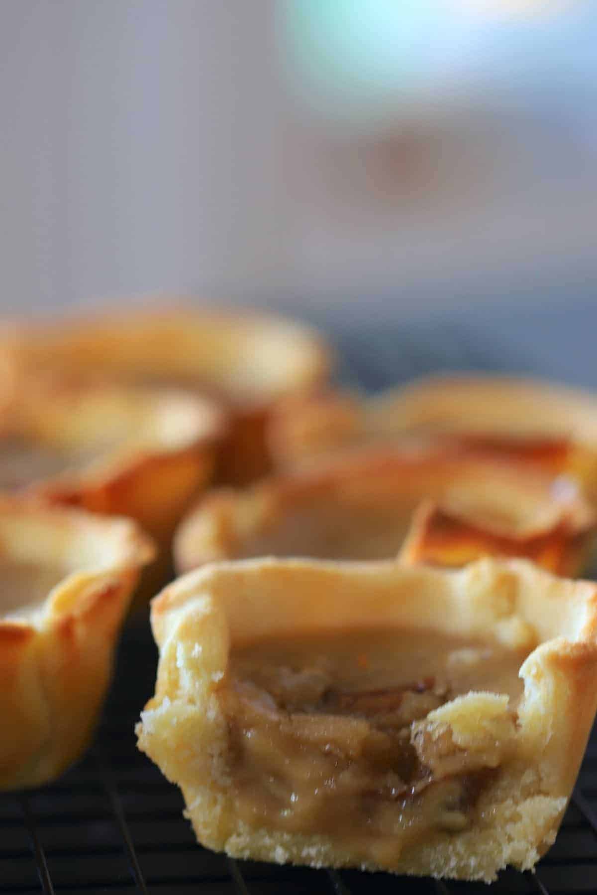 butter tart cut open showing the gooey filling.