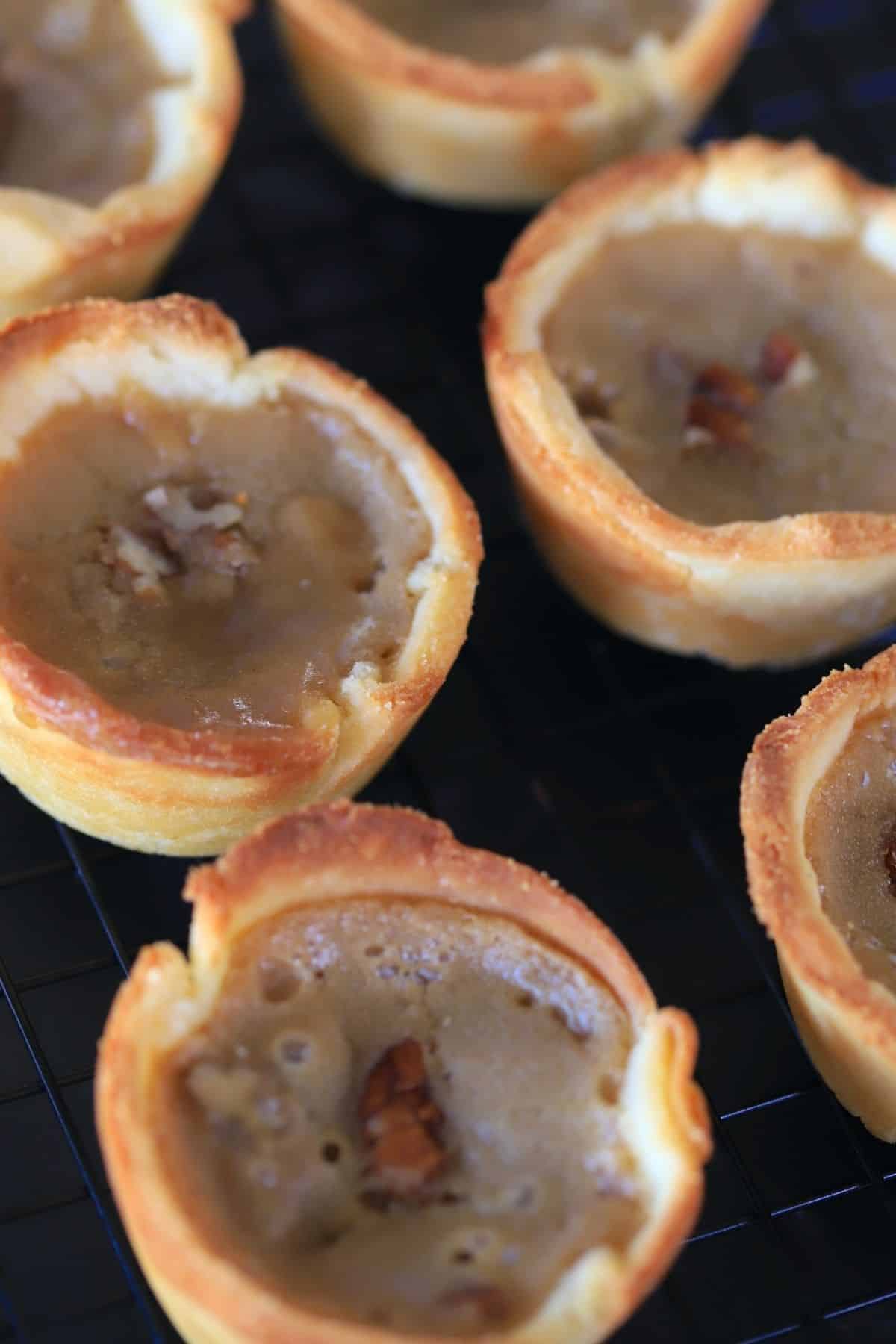 Baked butter tarts on black countertop