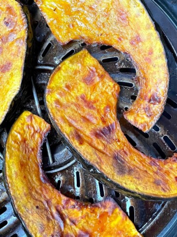kabocha squash wedges cooked in the air fryer basket