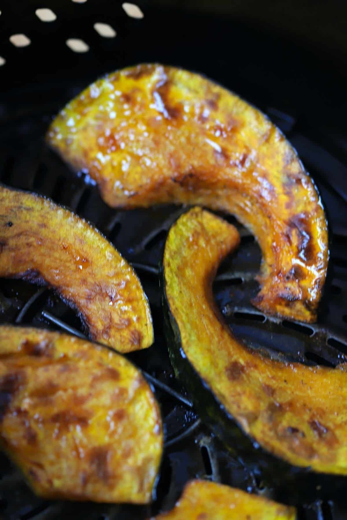 kabocha squash wedges cooked in the air fryer basket