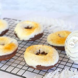 Keto Gingerbread Donuts with Cream Cheese Icing on a cooling rack