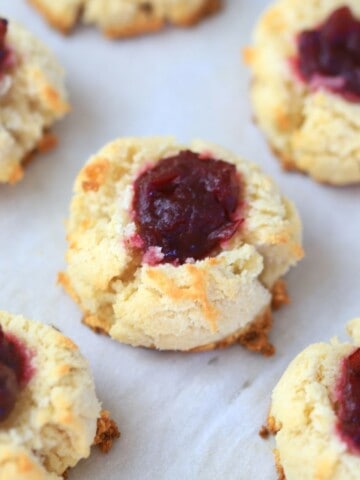 thumbprint cookies on parchment paper