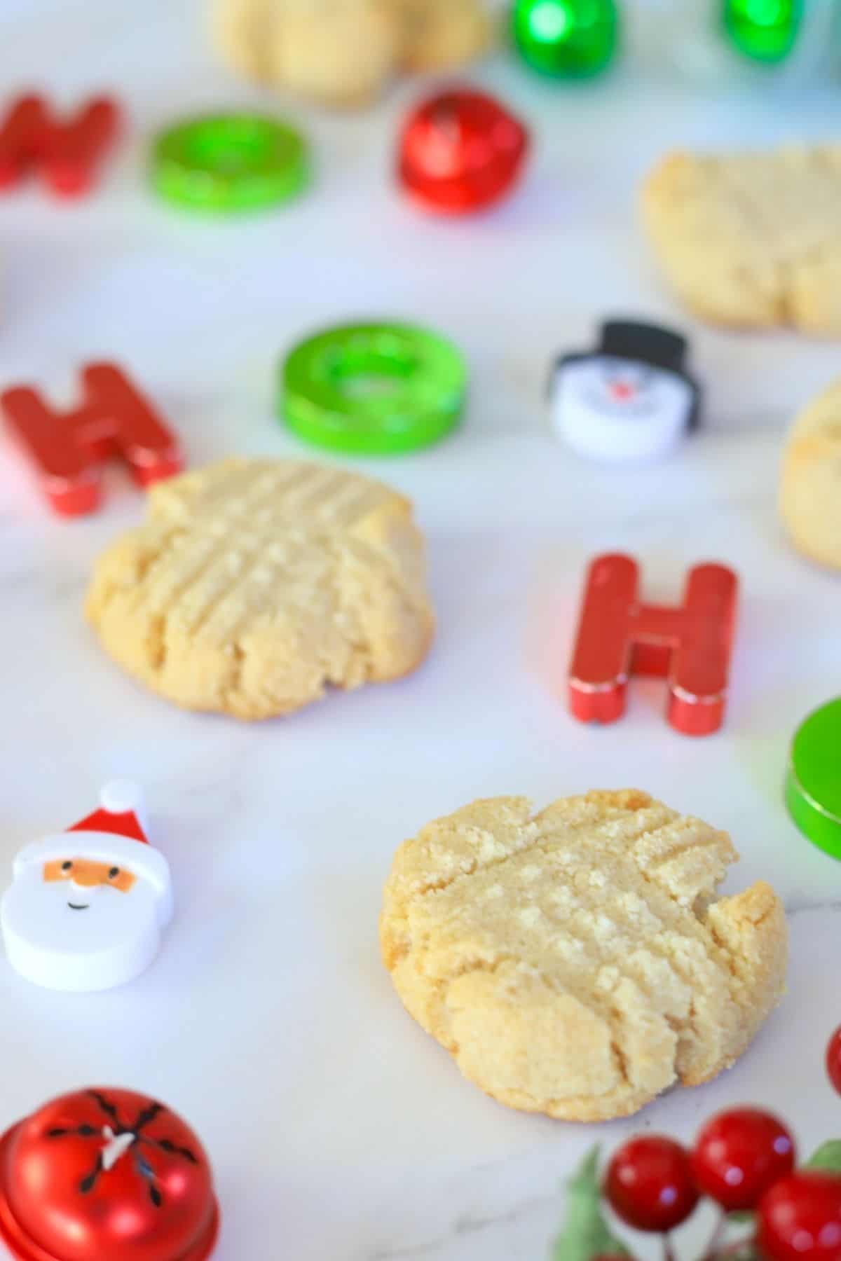 shortbread cookies on parchment paper with christmas decorations