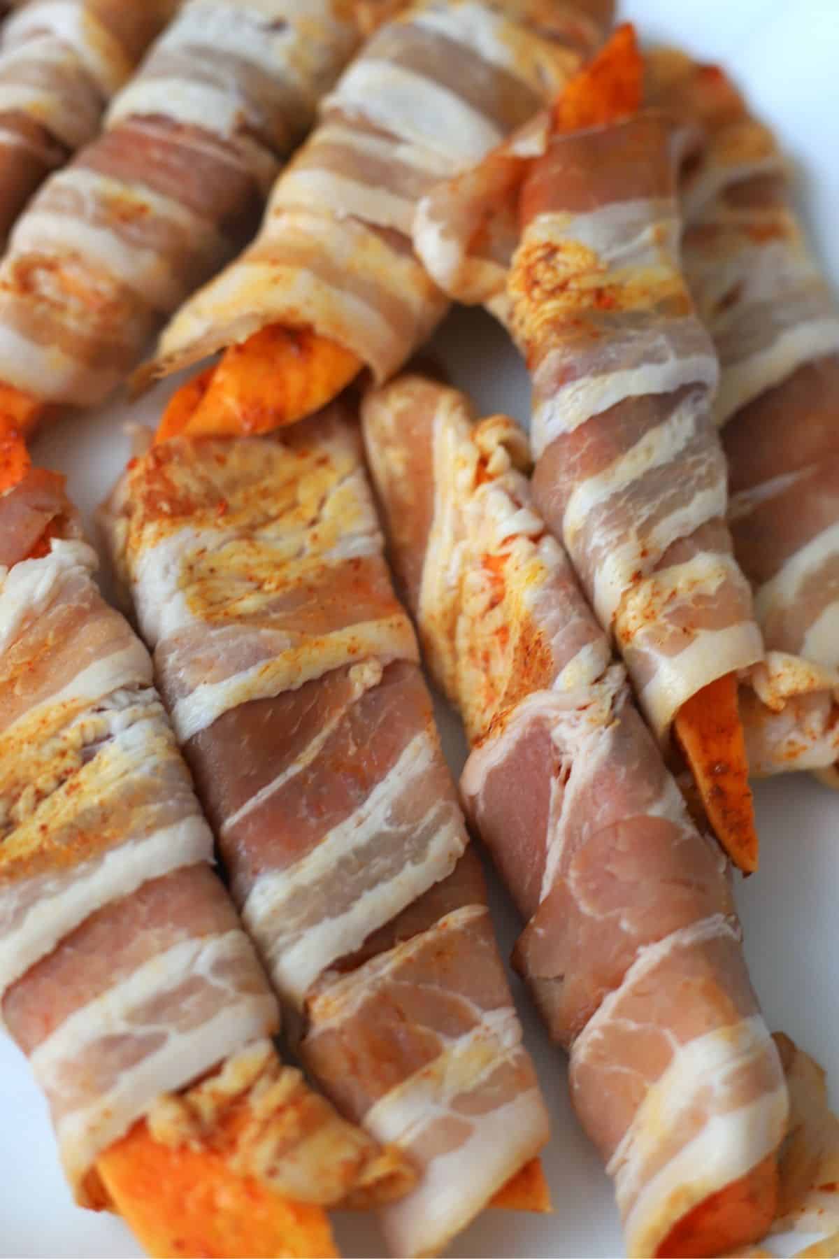 uncooked bacon wrapped sweet potatoes