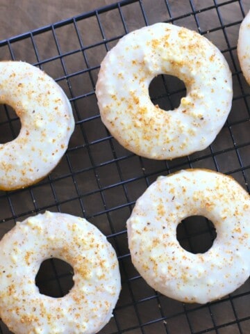 keto eggnog donuts on a cooling rack