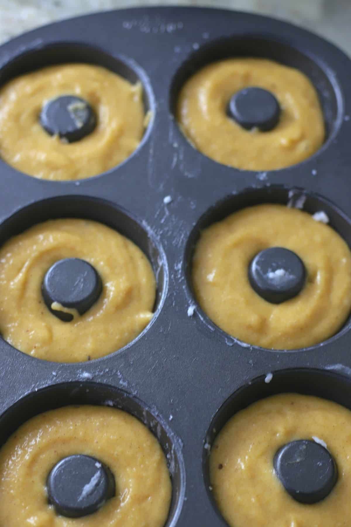 donut batter in a donut pan