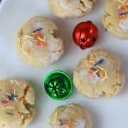 keto italian anise christmas cookies on a white platter with green and red bells