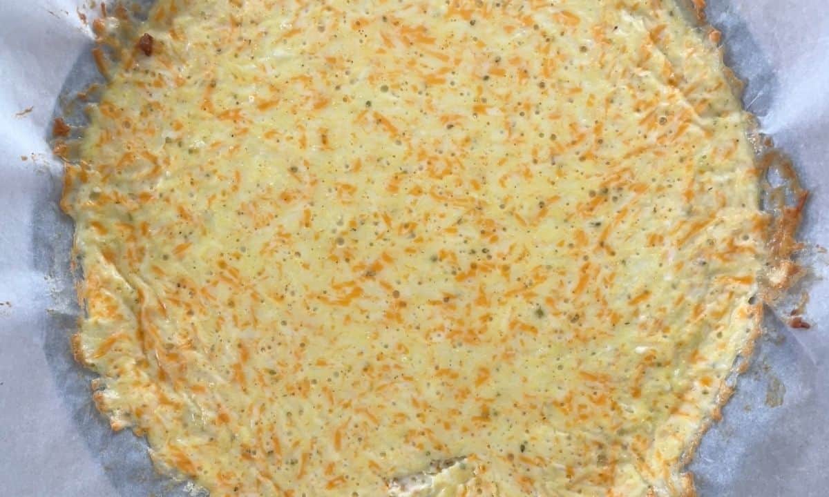 overhead shot of baked pizza crust.