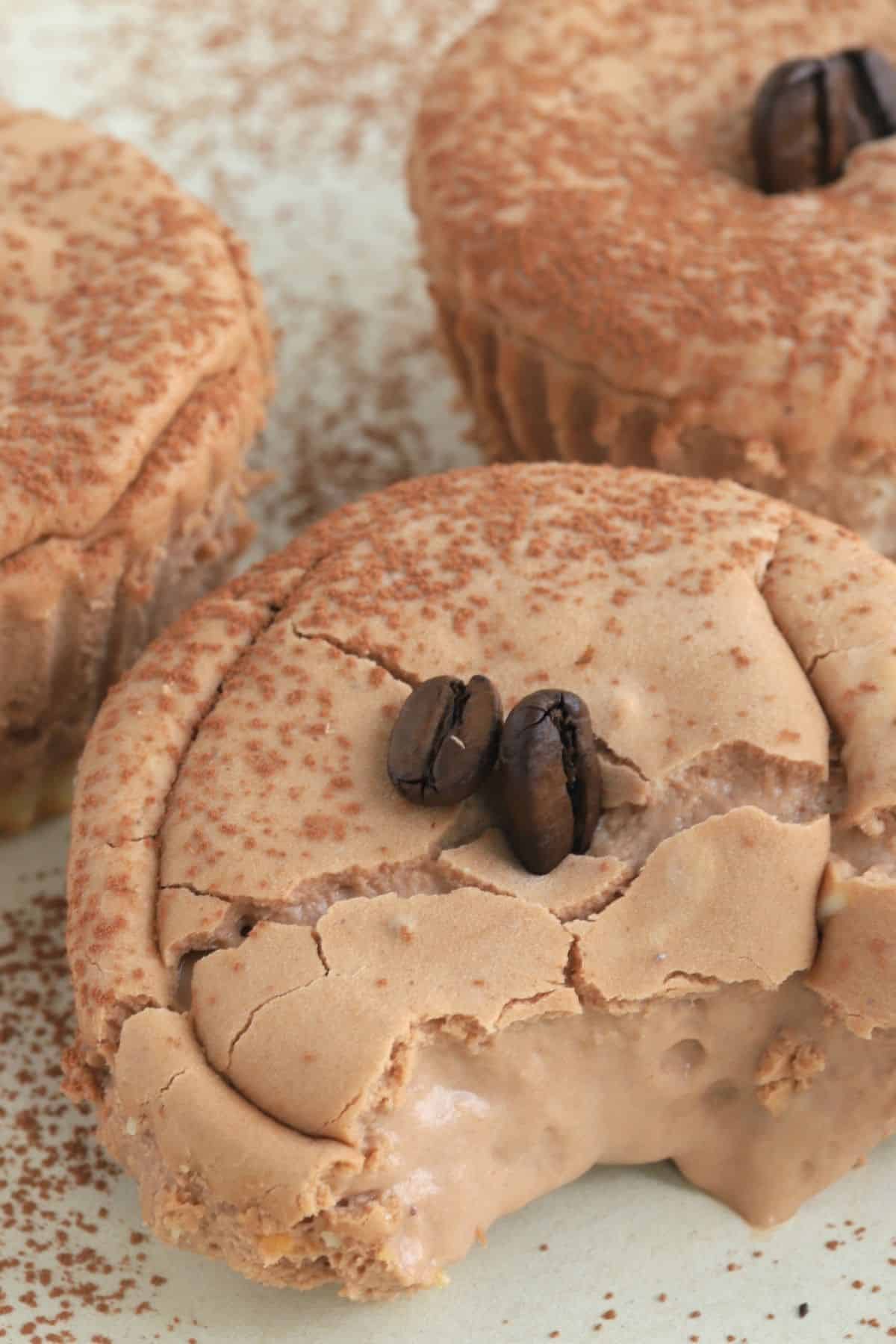 three mini cheesecakes on a plate.