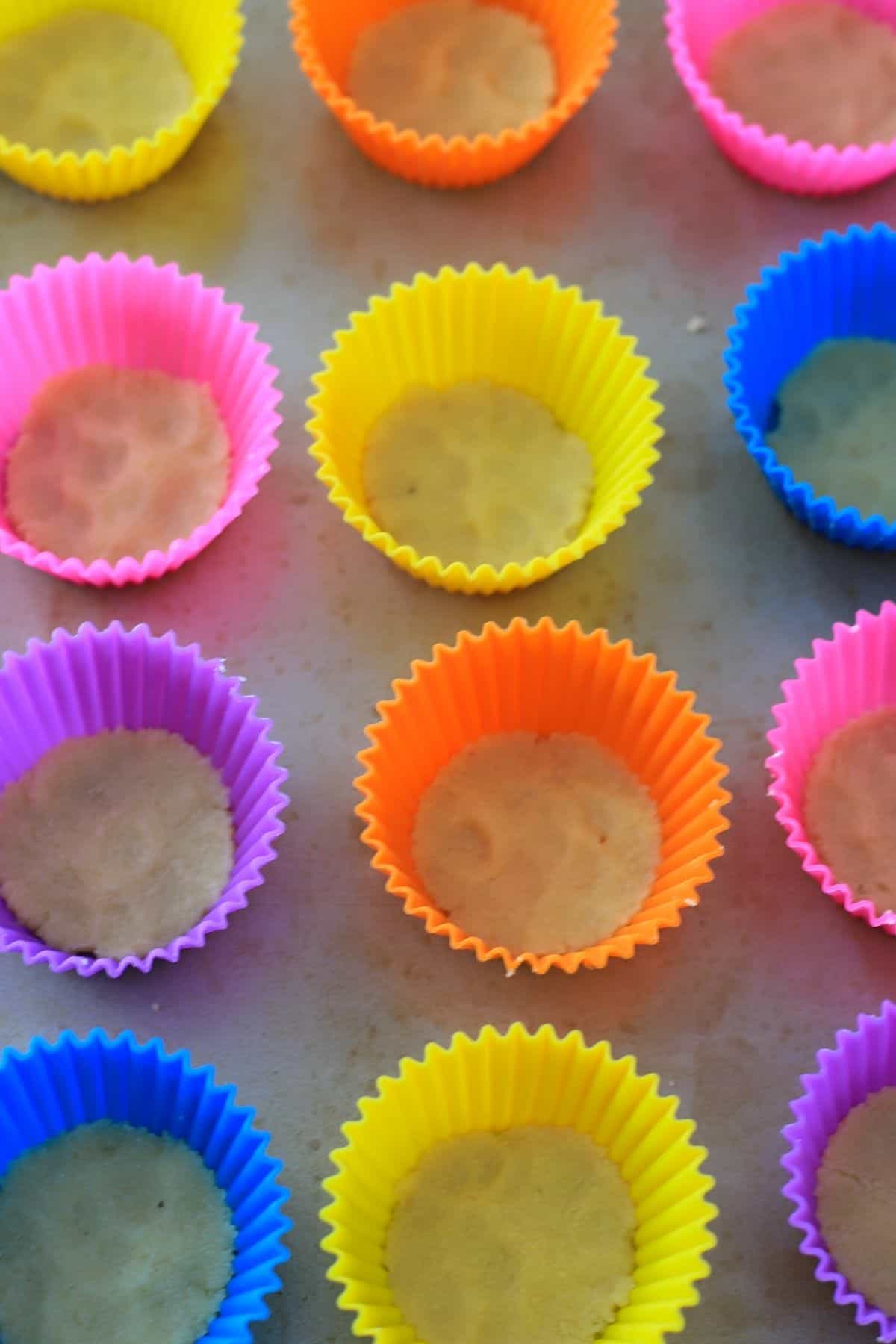 silicone cupcake liners filled with the almond crust.
