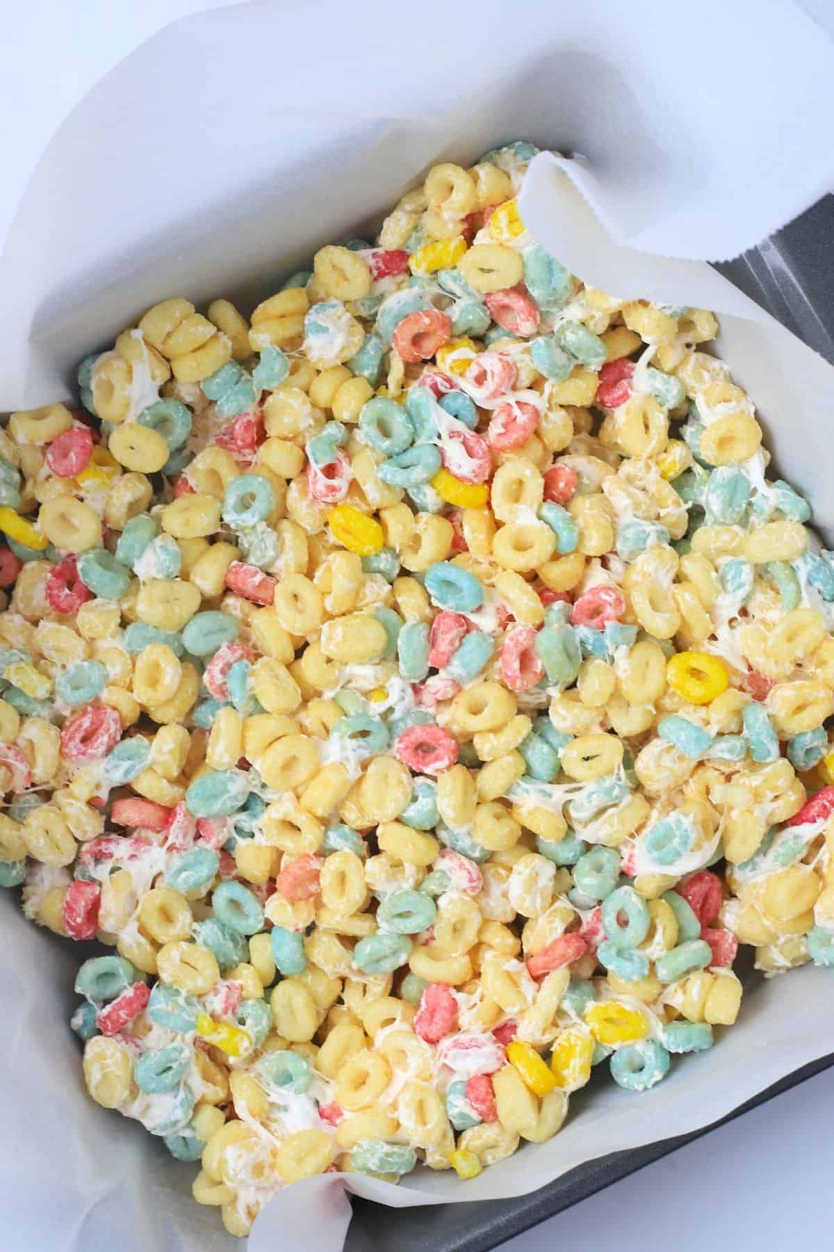 sugar free crispy treats in a square pan lined with parchment paper.