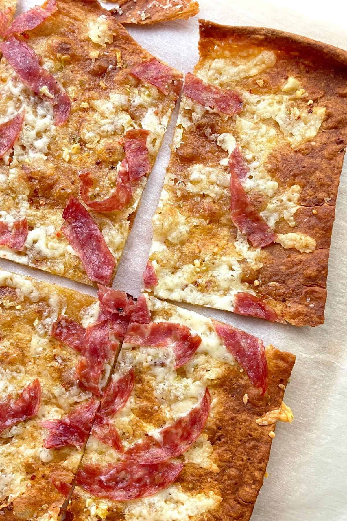 top down image of four slices of lavash bread pizza.