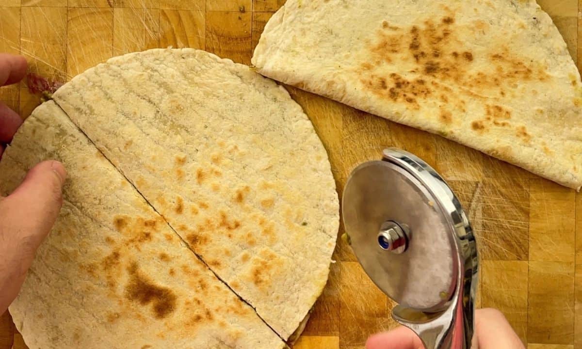 slicing quesadillas with a pizza knife.