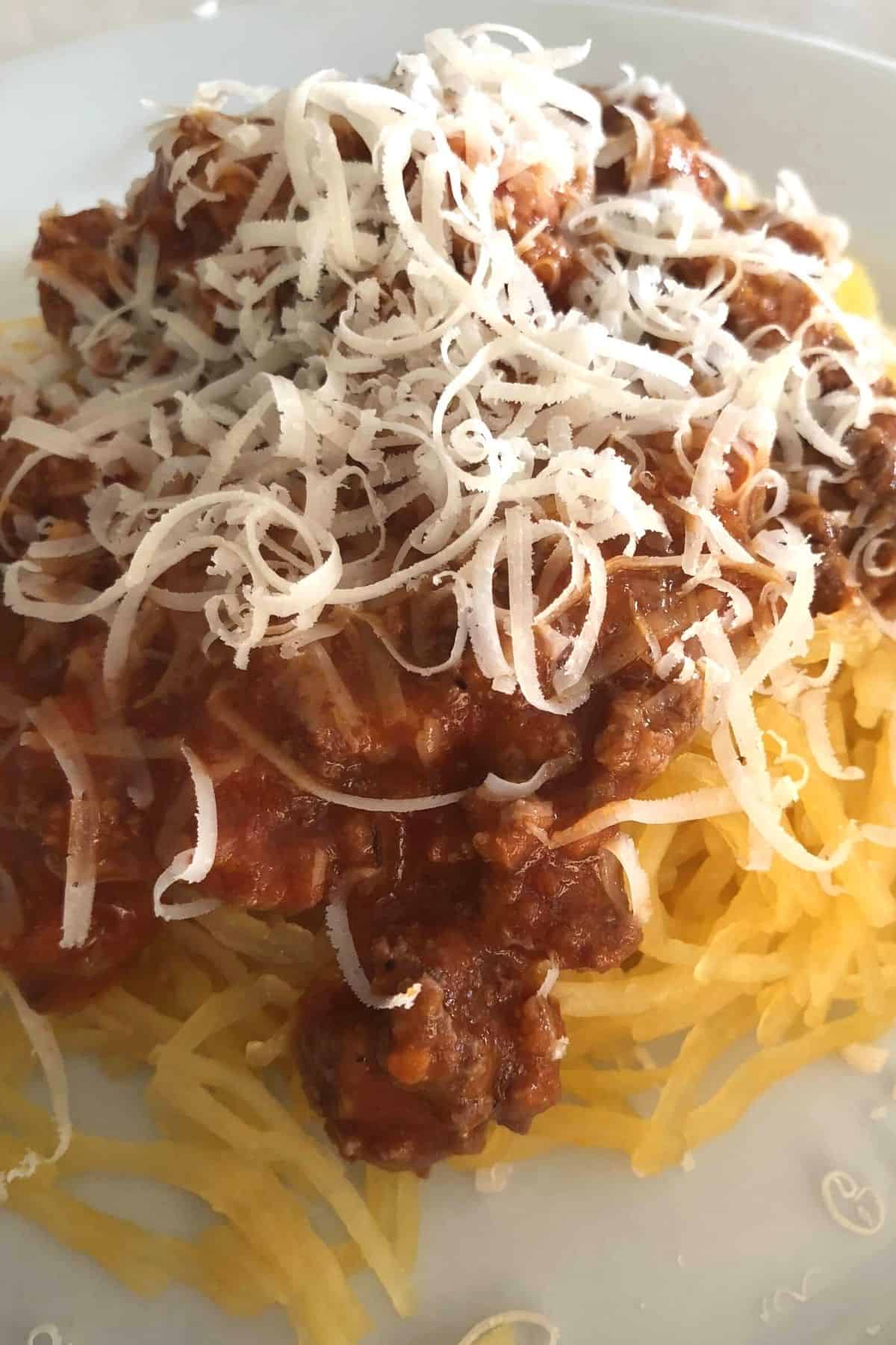 spaghetti squash noodles topped with a meat sauce and grated parmesan.