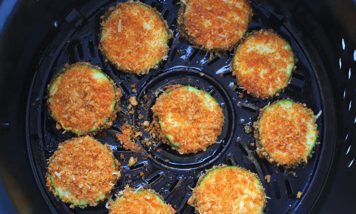 zucchini chips in the air fryer basket.