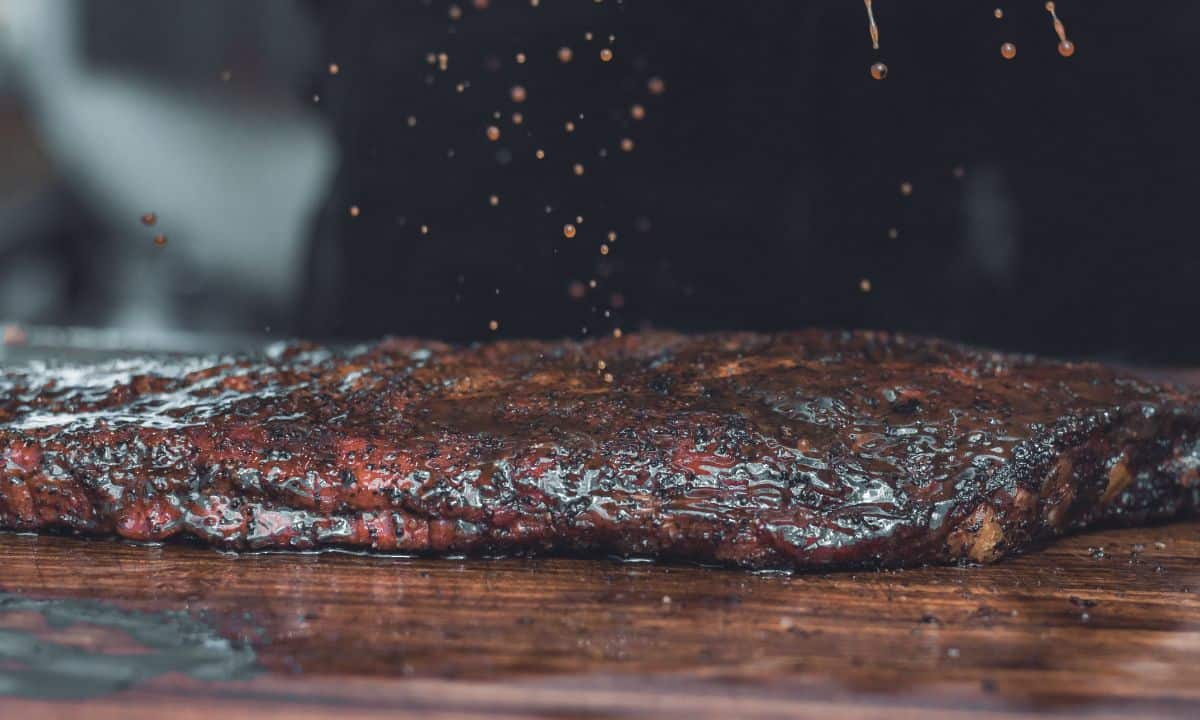 full rack of baby back ribs on a cutting poured.