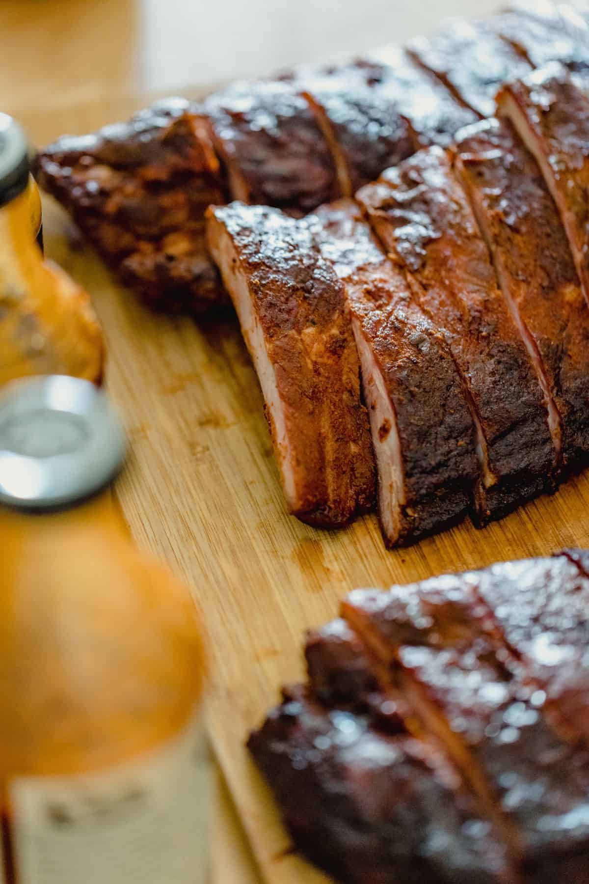 sliced ribs on a cutting board.