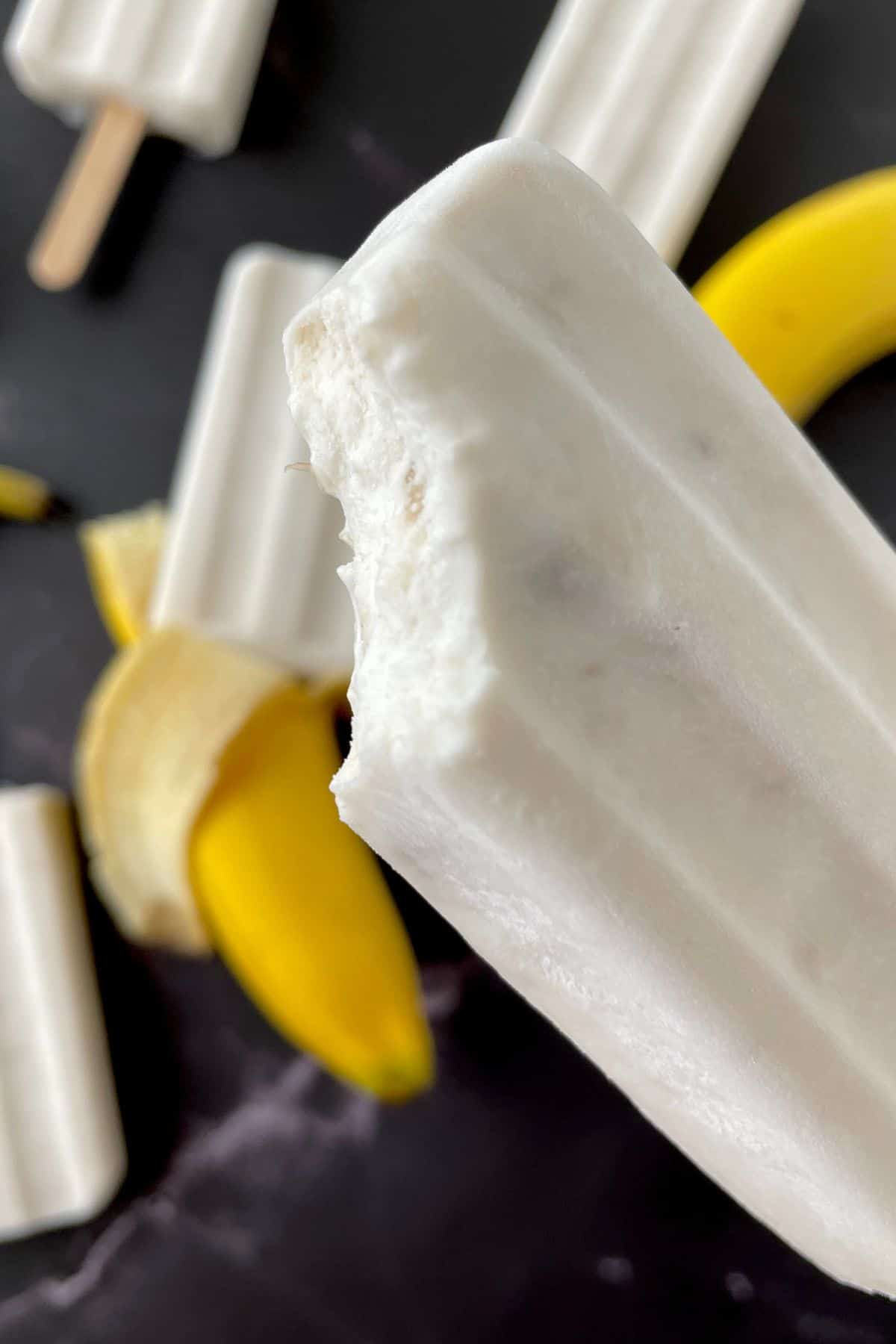 sugar free banana popsicle with a bite.