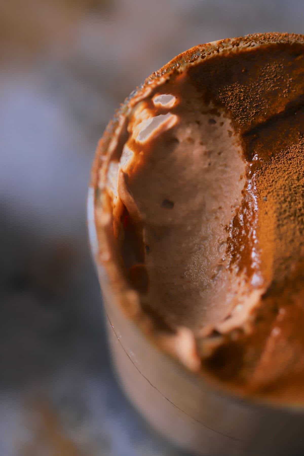 Closeup inside the tumbler of the keto tiramisu mousse.