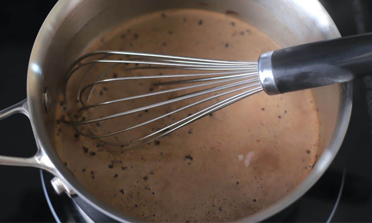 whisk in the pot with hot chocolate.