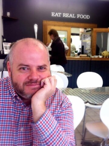 Oscar sitting at table in restaurant