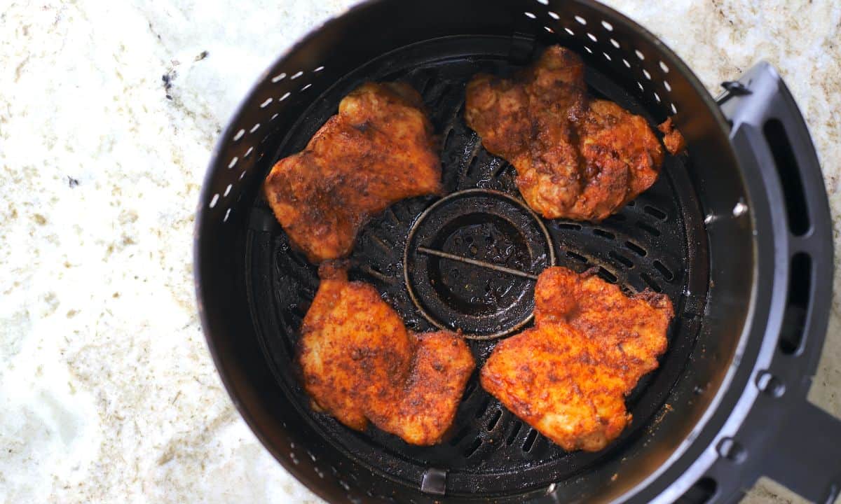 air fryer chicken in the air fryer basket.