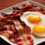 strips of bacon and two fried eggs.