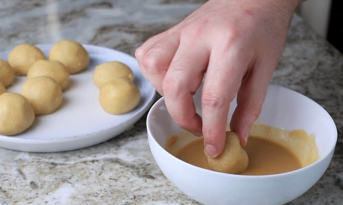 dipping the protein coffee bites in the coffee glaze.