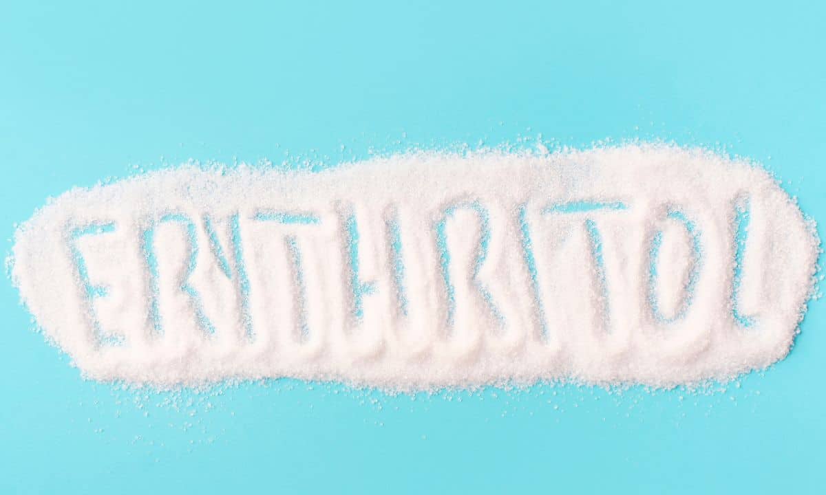 erythritol powder with the word erythritol drawn in the sweetener.