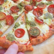 grabbing a slice of pizza.