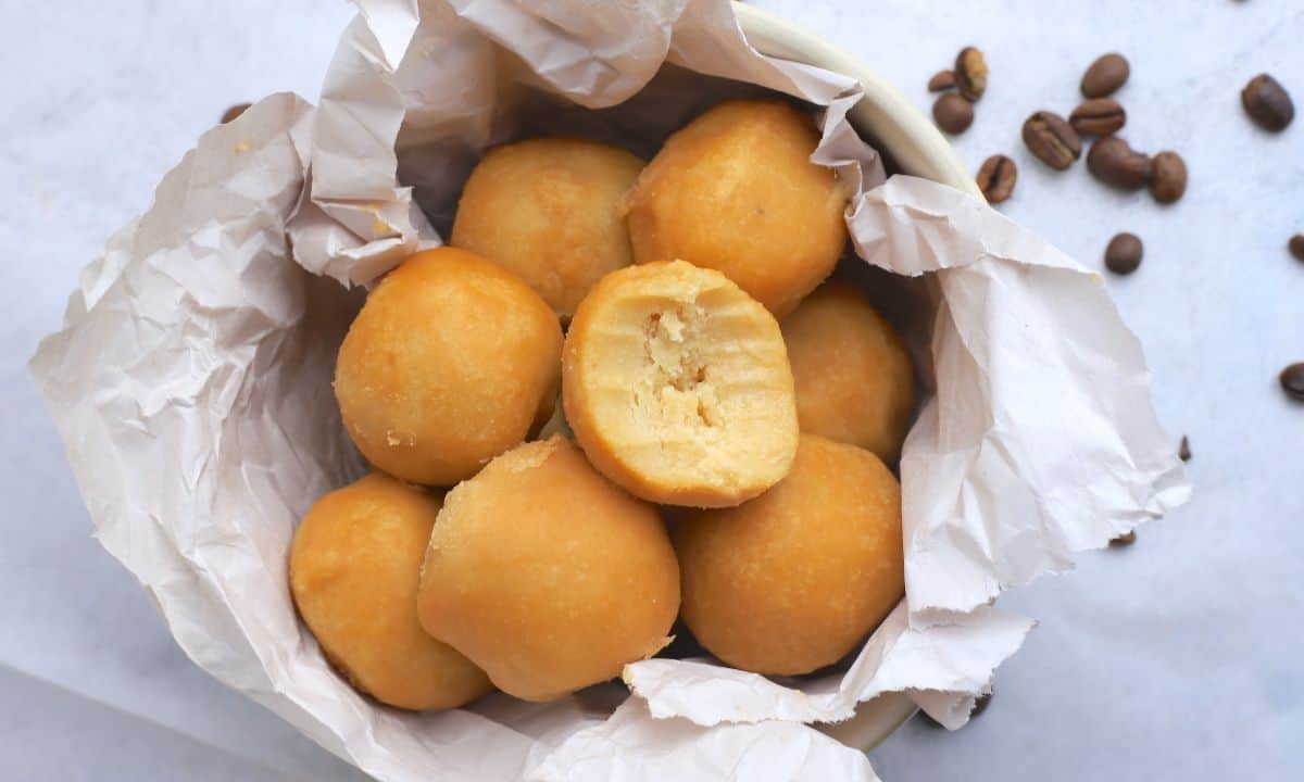 Maple protein coffee bites in a bowl lined with crumpled parchment paper.