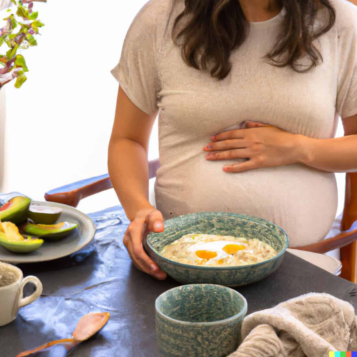 pregnant female with gestational diabetes eating breakfast of eggs and avocados.