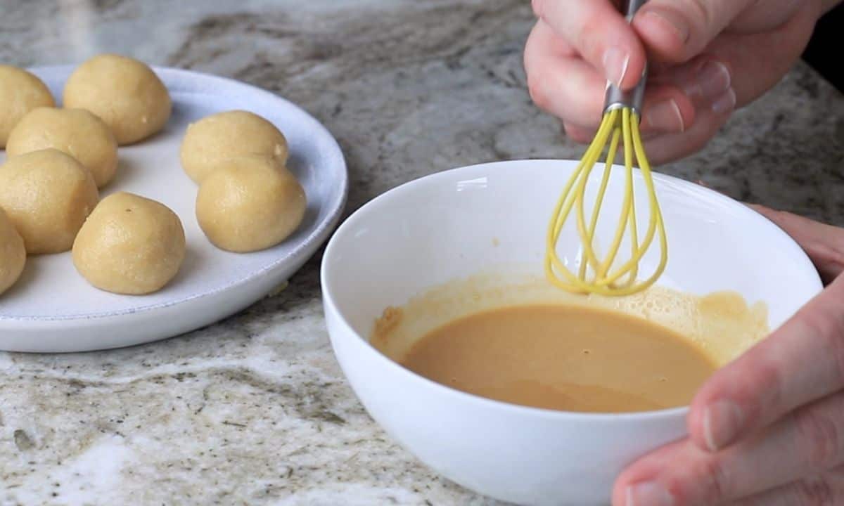 whisking the coffee glaze.