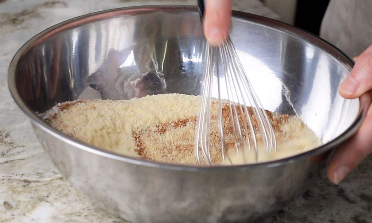 whising the dry ingredients in a stainless steel bowl.